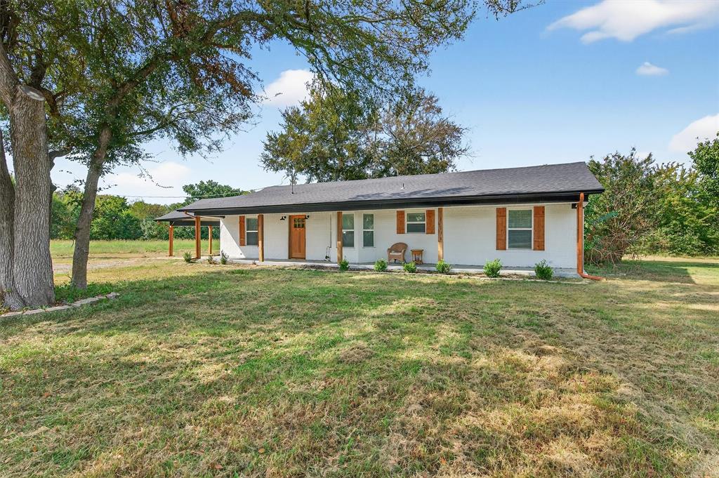 621 Craft Road Bells, TX 75414 - Photo 2 of 40 a view of a house with a backyard