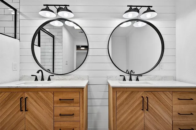 a bathroom with a mirror and a sink