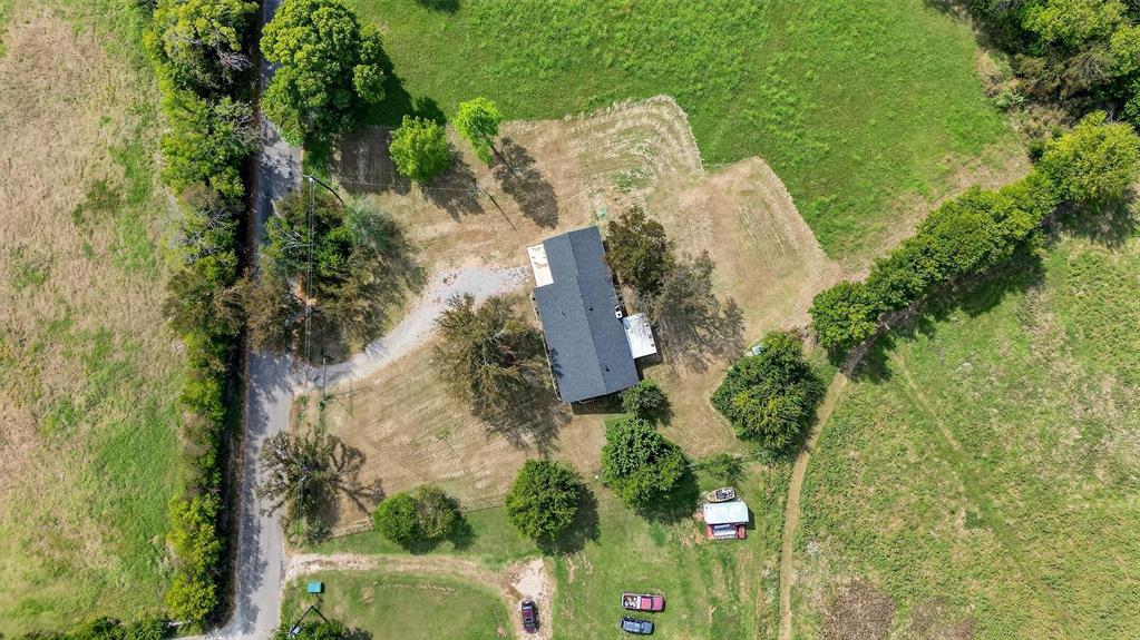 621 Craft Road Bells, TX 75414 - Photo 36 of 40 an aerial view of a house with a yard and trees