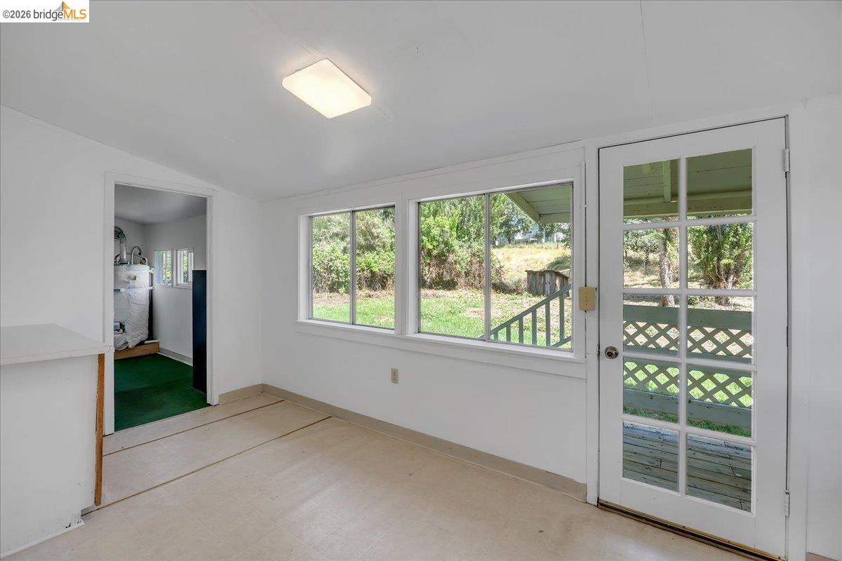 10624 Campo Seco Road Jamestown, CA 95327 - Photo 15 of 46 a view of empty room with floor to ceiling windows and yard