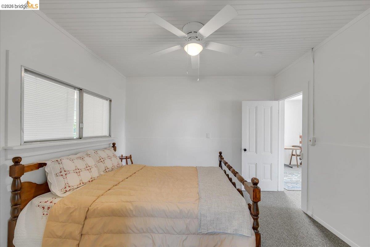 10624 Campo Seco Road Jamestown, CA 95327 - Photo 20 of 46 a bedroom with a bed and a ceiling fan