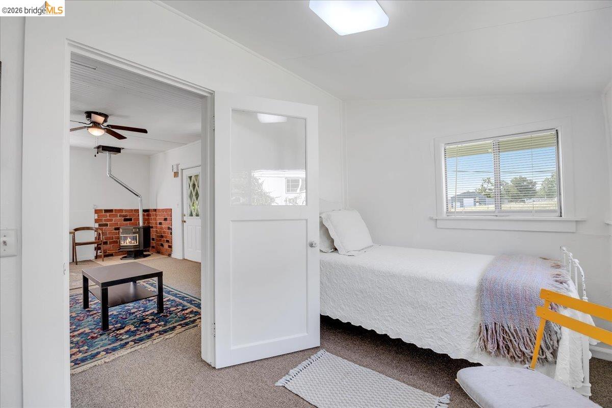 10624 Campo Seco Road Jamestown, CA 95327 - Photo 24 of 46 a bedroom with a bed and a table in it