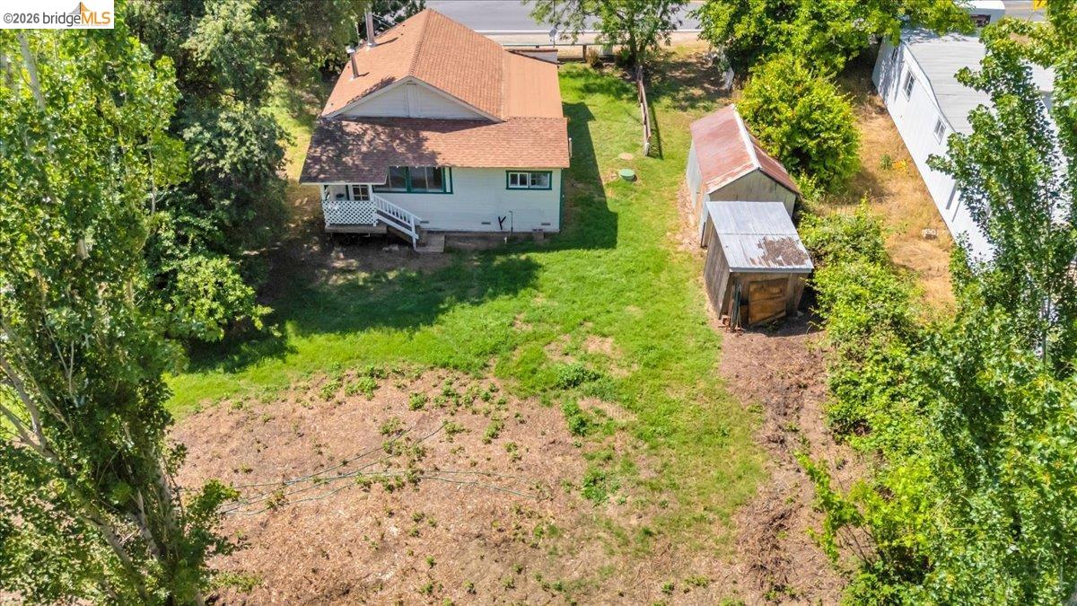10624 Campo Seco Road Jamestown, CA 95327 - Photo 30 of 46 a aerial view of a house with a yard and table and chairs