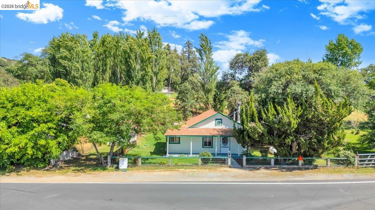 10624 Campo Seco Road Jamestown, CA 95327 - Photo 6 of 46 a view of house with outdoor space and trees