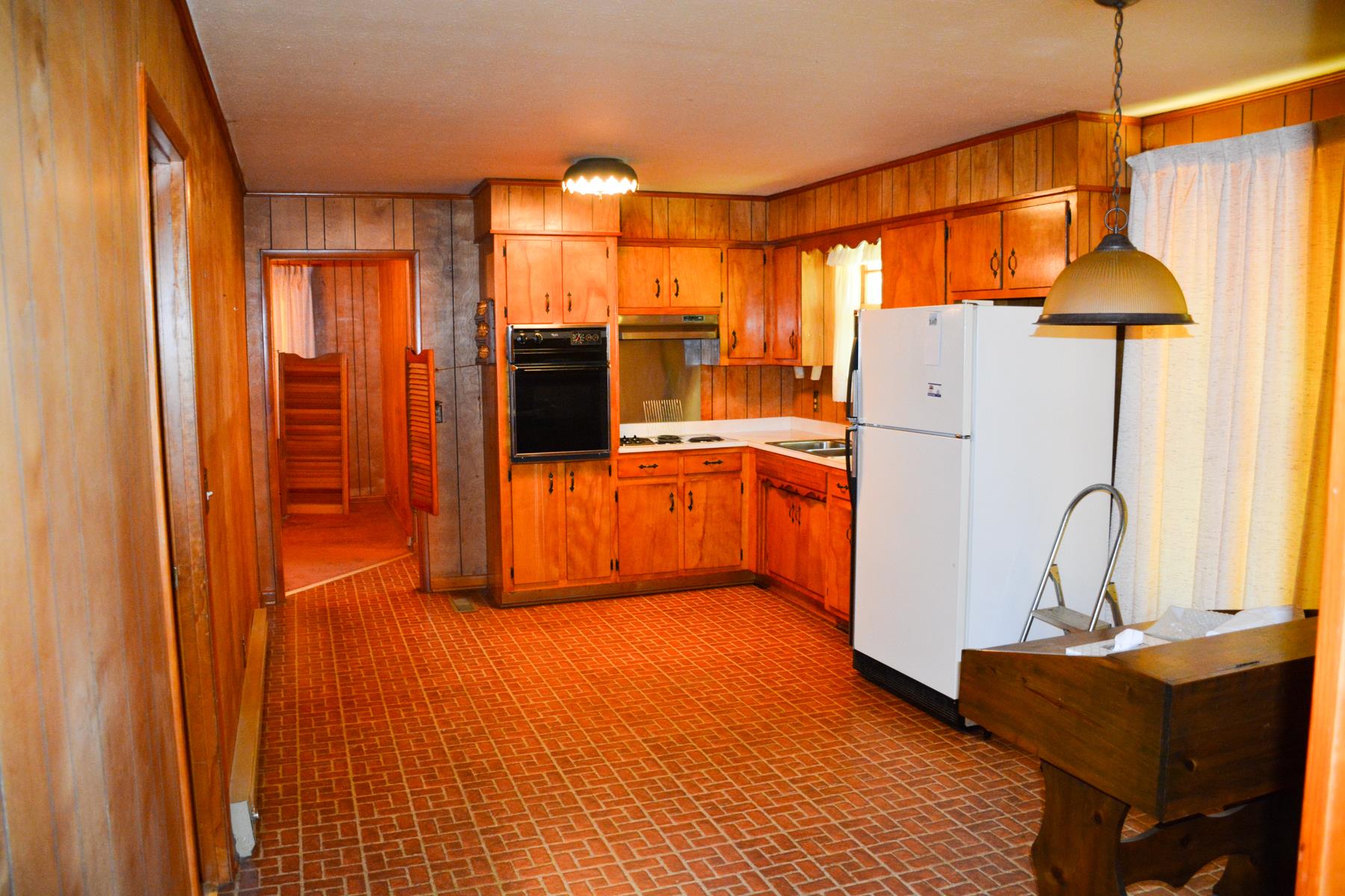 8811 Lyles Road Lyles, TN 37098 - Photo 5 of 18 a kitchen with refrigerator and cabinets
