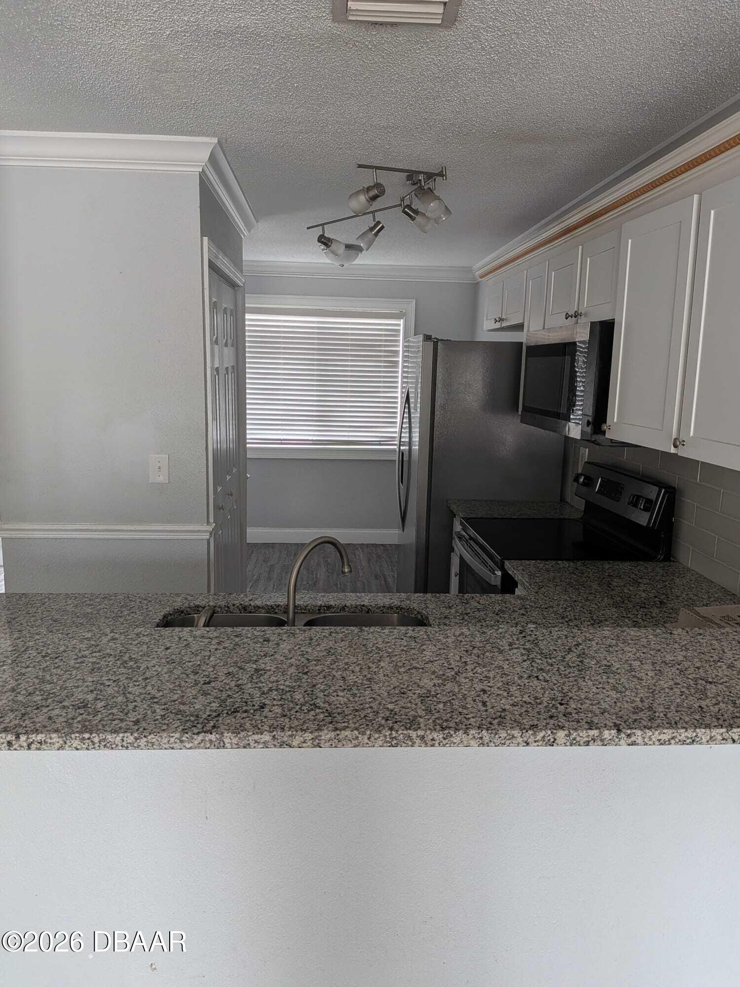 480 Reed Canal Road, Unit 57 South Daytona, FL 32119 - Photo 4 of 10 a living room with a couch