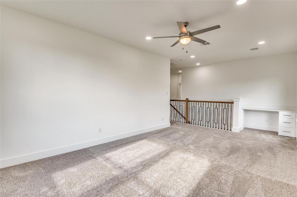 7307 Rubio Place Dallas, TX 75235 - Photo 9 of 17 a view of a livingroom with a ceiling fan and window