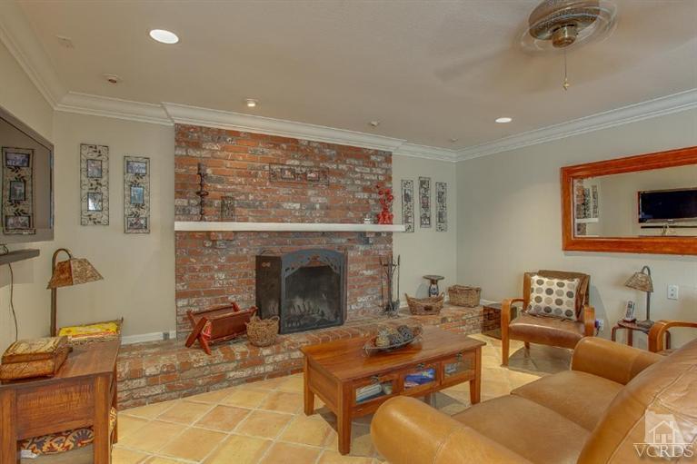 2283 Ralston Street Simi Valley, CA 93063 - Photo 14 of 37 a living room with furniture and a fireplace
