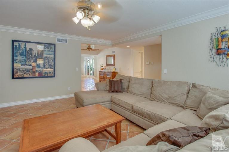 2283 Ralston Street Simi Valley, CA 93063 - Photo 4 of 37 a living room with furniture a large window and a chandelier