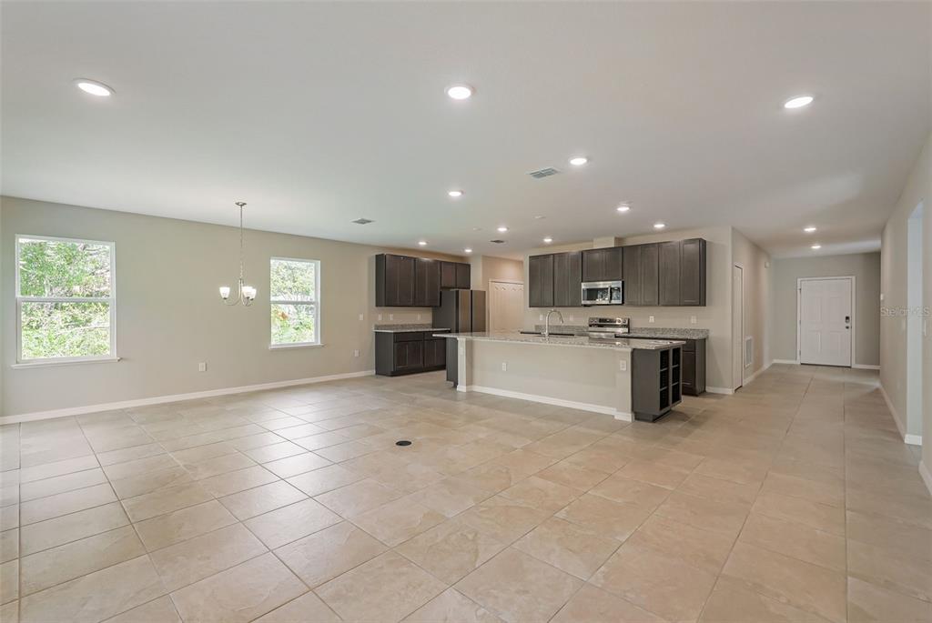 12899 Florida Avenue Astatula, FL 34705 - Photo 24 of 50 a view of kitchen with kitchen island and stainless steel appliances