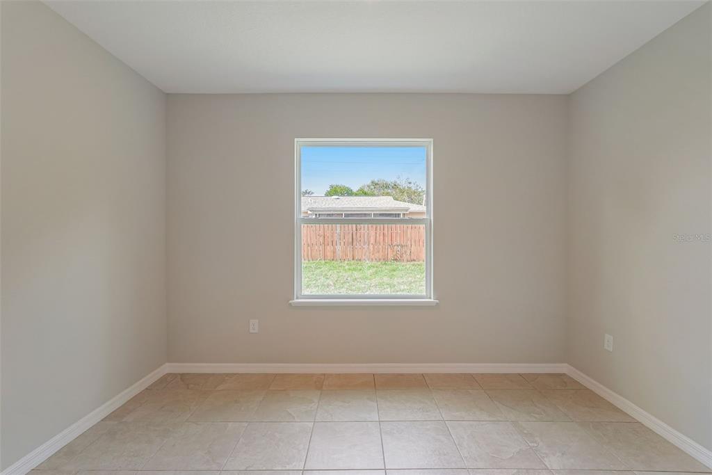 12899 Florida Avenue Astatula, FL 34705 - Photo 32 of 50 an empty room with a window