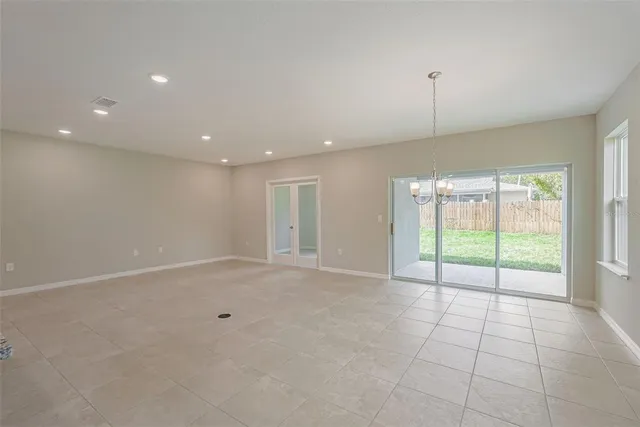 a bathroom with a granite countertop sink a toilet and a mirror