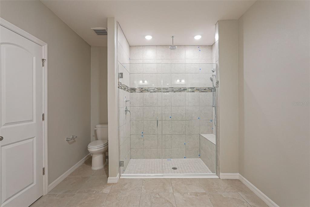 12899 Florida Avenue Astatula, FL 34705 - Photo 37 of 50 a bathroom with a shower and a toilet