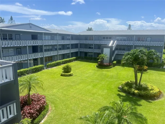 a view of swimming pool from a garden
