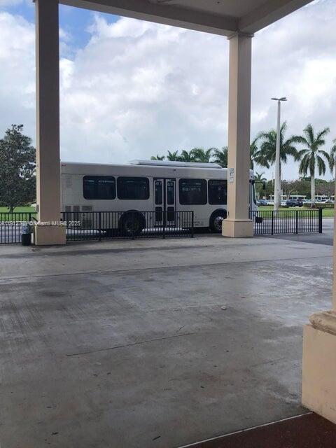 155 Suffolk F, Unit D Boca Raton, FL 33434 - Photo 18 of 22 a view of a house with a yard
