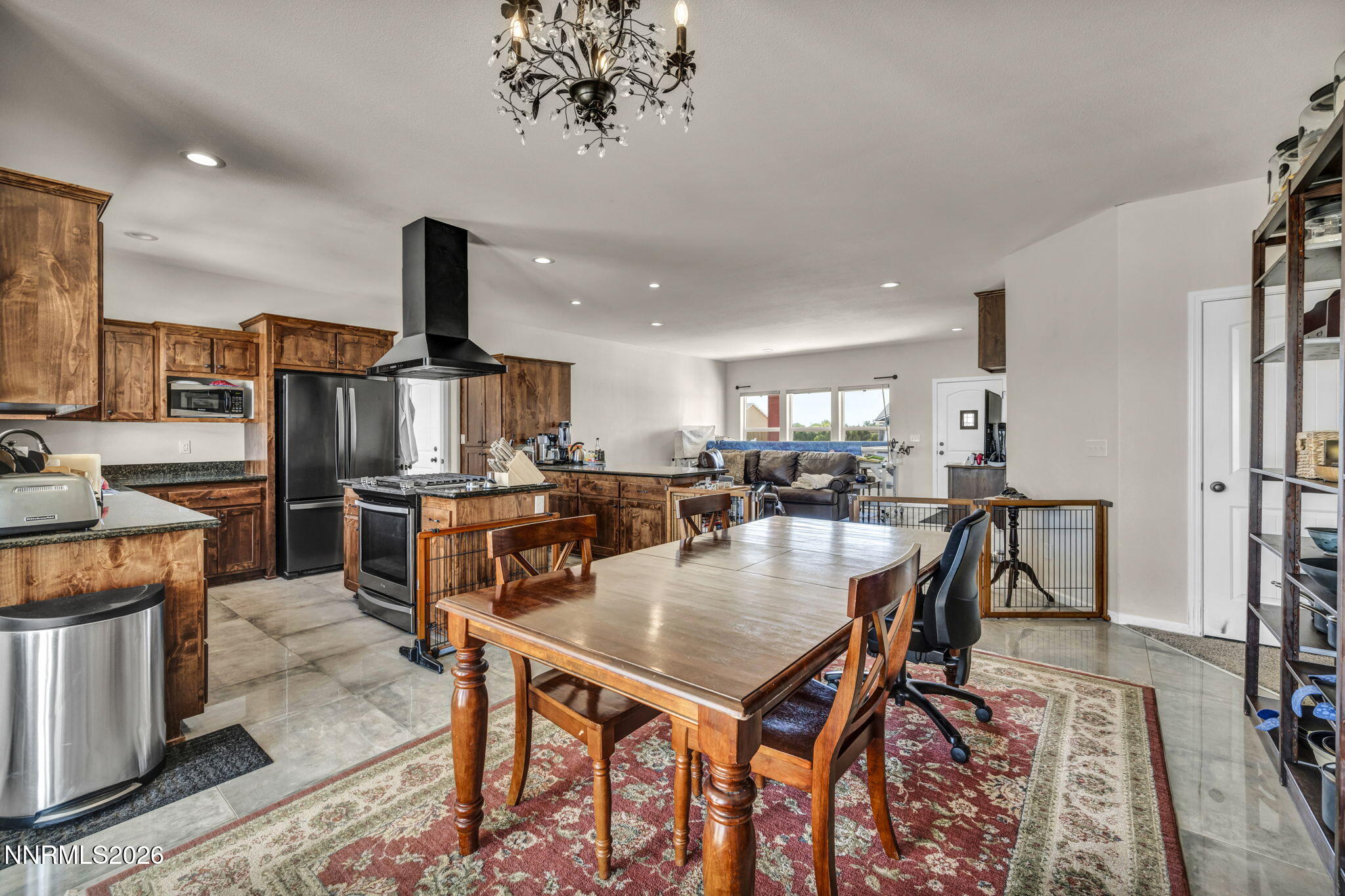 1286 Sky Ridge Drive Fallon, NV 89406 - Photo 18 of 49 an open kitchen with a table and chairs