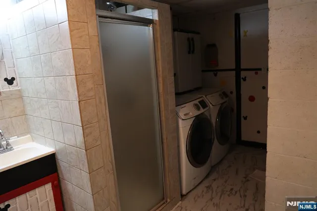 a utility room with dryer and washer