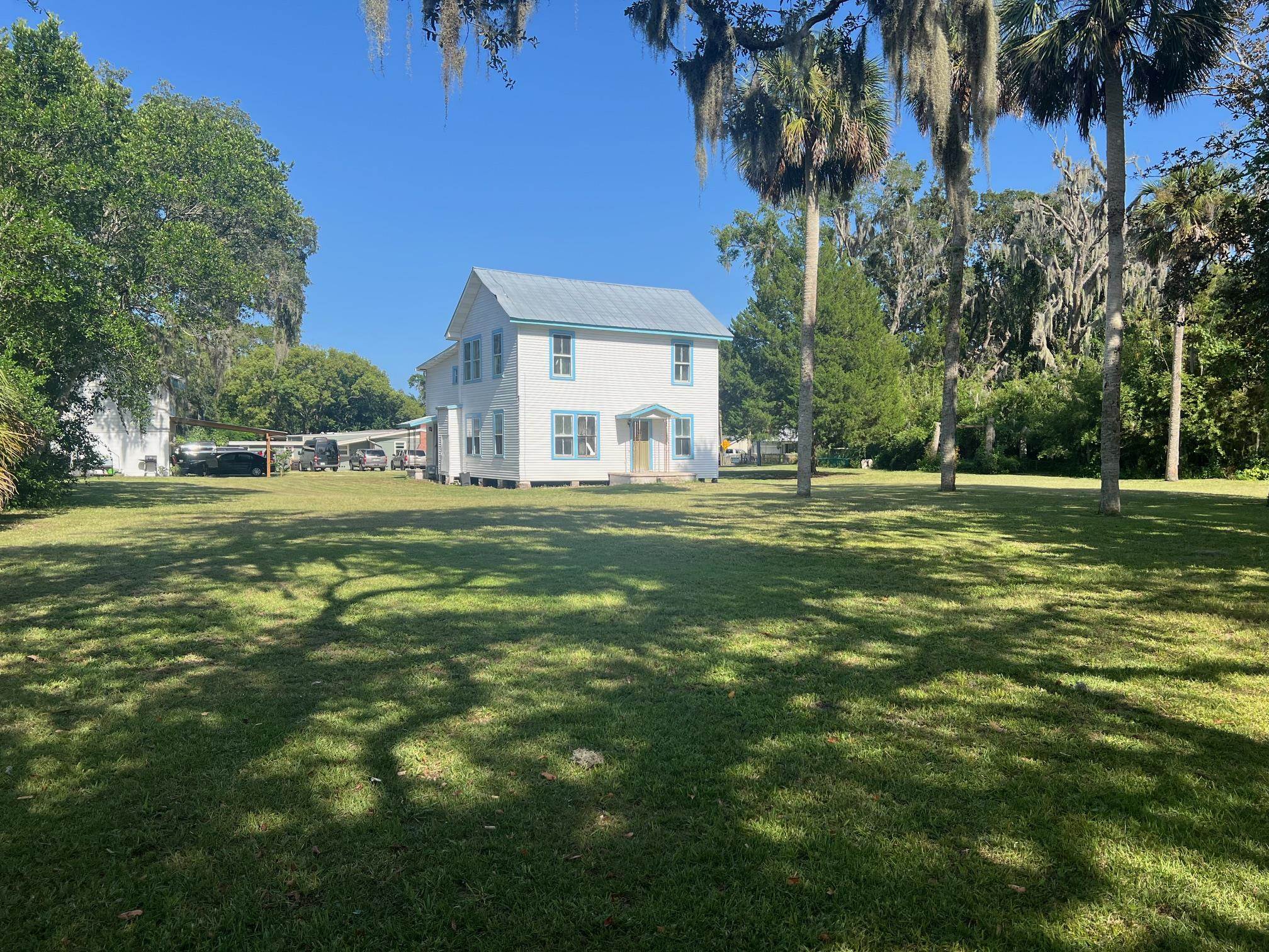 41 1/2 Madeore Street St. Augustine, FL 32084 - Photo 3 of 24 a large building with trees in the background