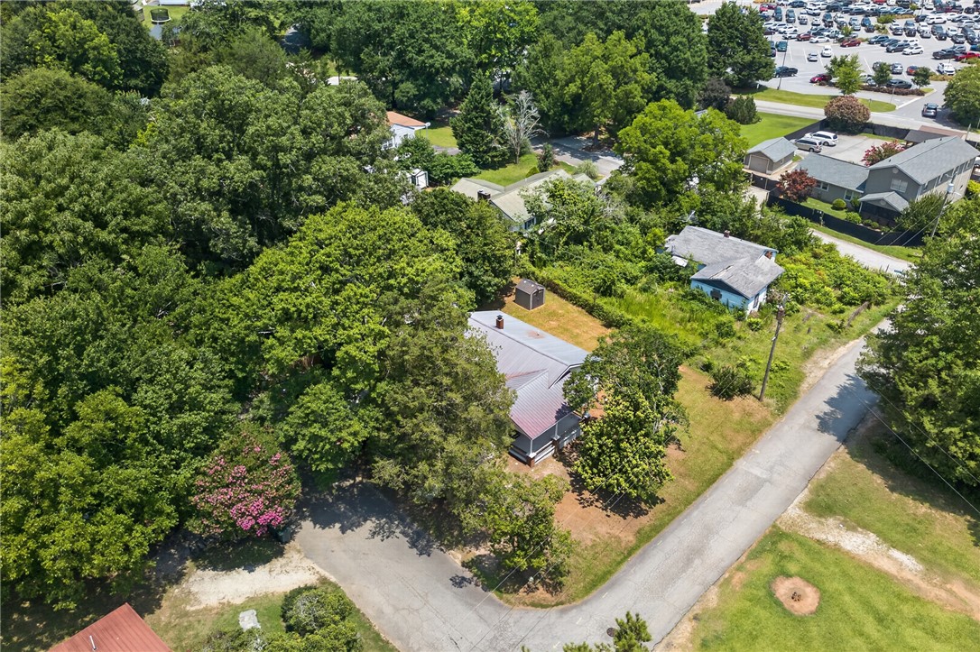 115 Pelfrey Street Seneca, SC 29672 - Photo 40 of 46 Mature trees canopy this property, offering a tranquil, secluded feel in a vibrant area.