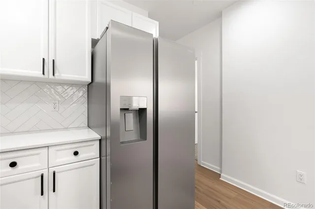 a white refrigerator freezer sitting inside of a kitchen
