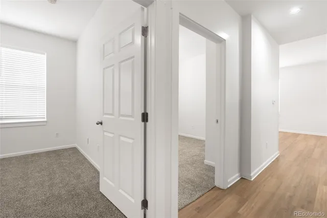 a view of a bathroom with wooden floor