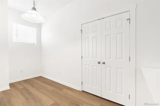 a view of a kitchen with wooden floor