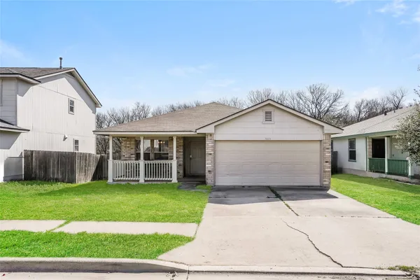 a view of a yard in front view of a house