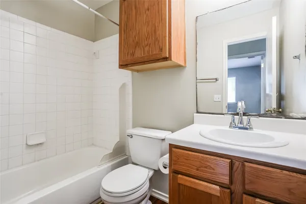 a bathroom with a sink a toilet and bathtub