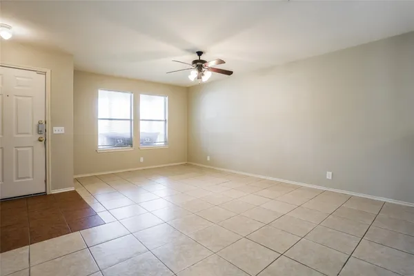 a view of an empty room and window