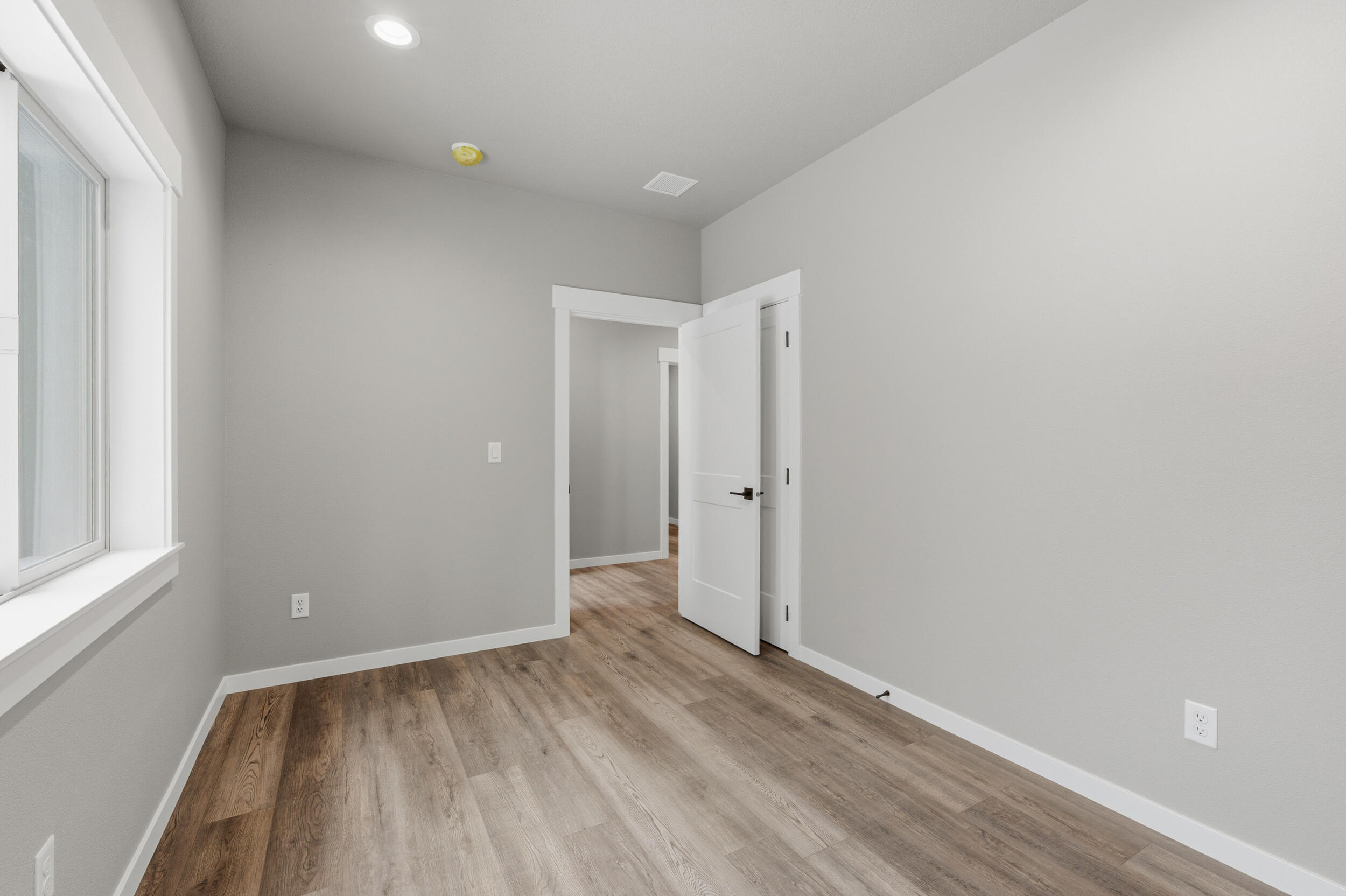 16083 Dyke Road, Unit 9 La Pine, OR 97739 - Photo 30 of 53 a view of room with window and hardwood floor