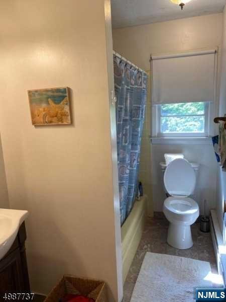 552 Stevens Avenue Ridgewood, NJ 07450 - Photo 11 of 43 a bathroom with a toilet and a shower