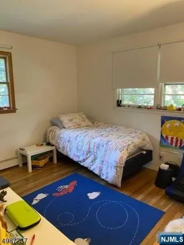 a bathroom with a sink toilet and a mirror