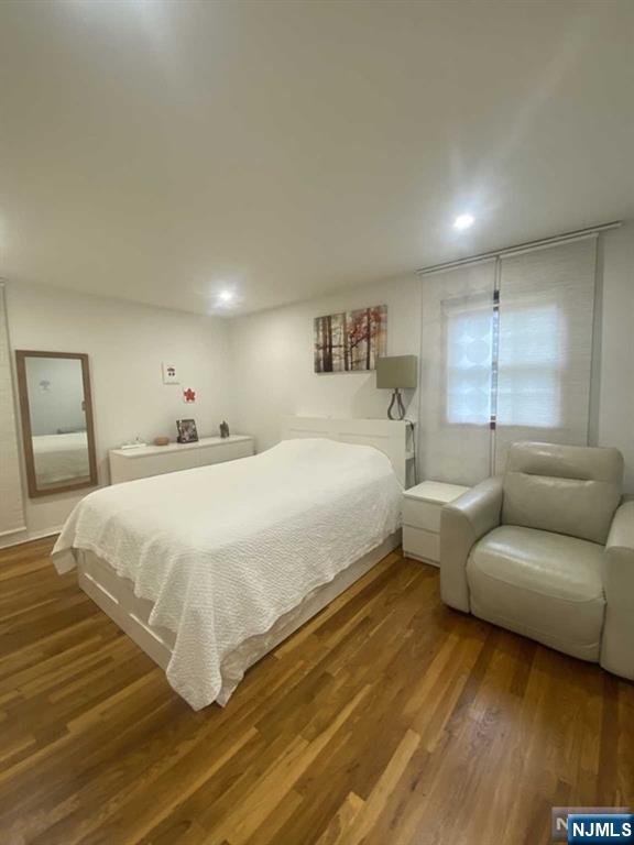 552 Stevens Avenue Ridgewood, NJ 07450 - Photo 27 of 43 a bedroom with a bed and a couch