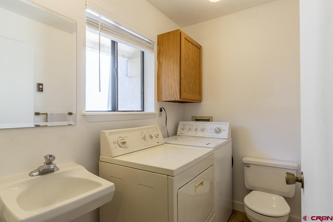 1900 Florida Road, Unit A6 Durango, CO 81301 - Photo 11 of 25 a bathroom with a sink a toilet and a mirror