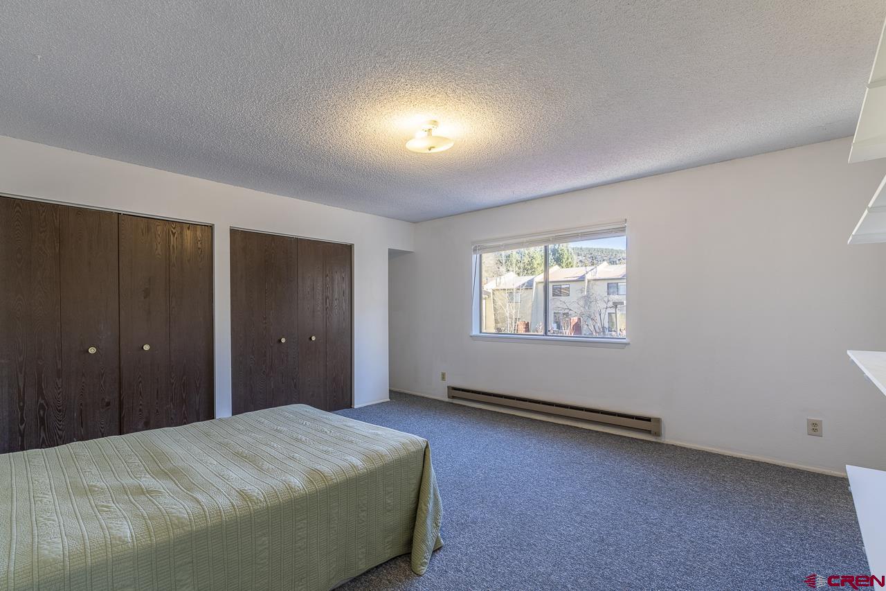 1900 Florida Road, Unit A6 Durango, CO 81301 - Photo 13 of 25 a bedroom with a bed and a window