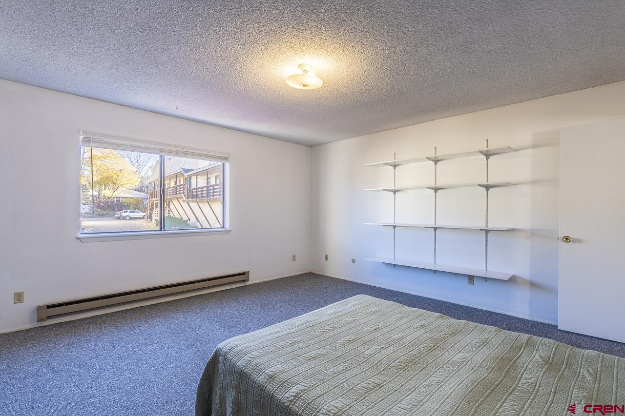1900 Florida Road, Unit A6 Durango, CO 81301 - Photo 14 of 25 an empty room with windows and closet