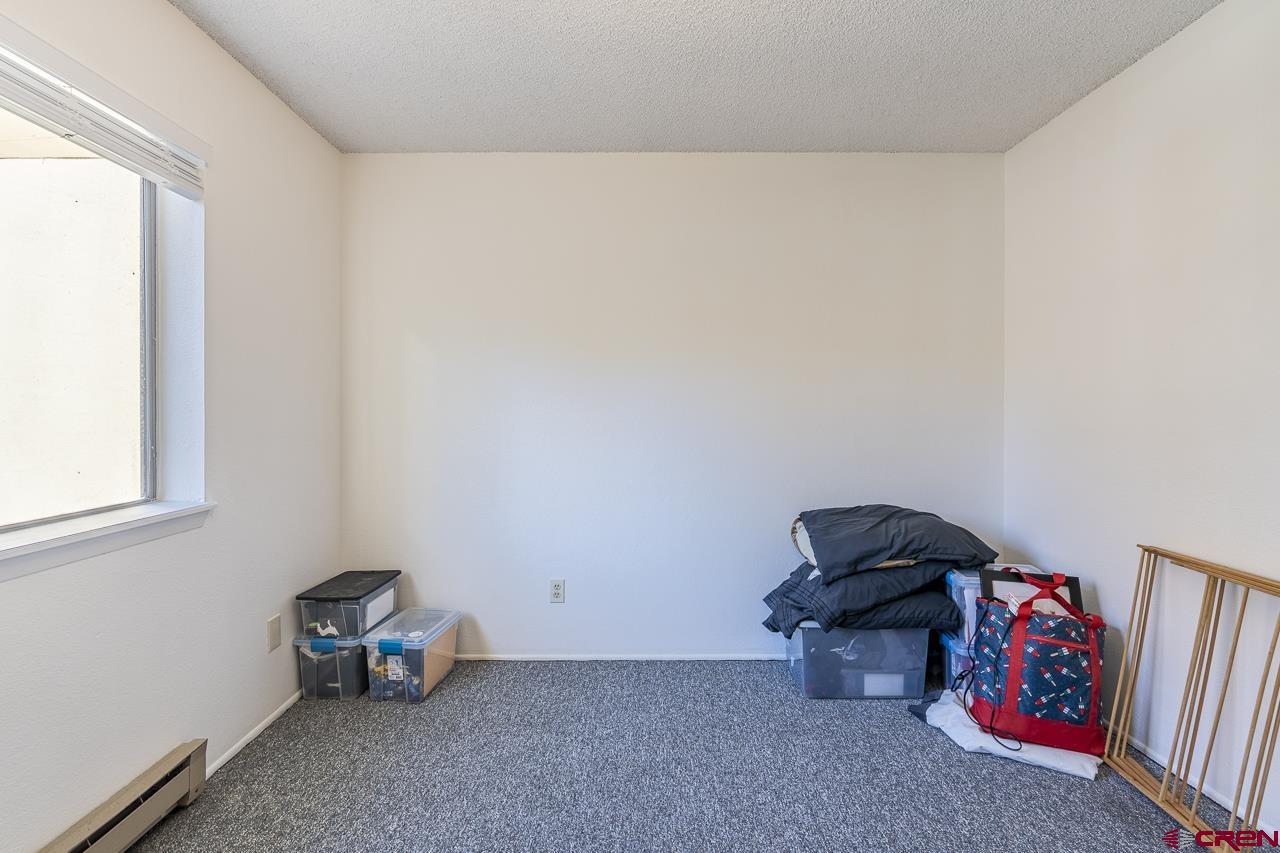 1900 Florida Road, Unit A6 Durango, CO 81301 - Photo 17 of 25 a bedroom with a bed and a window