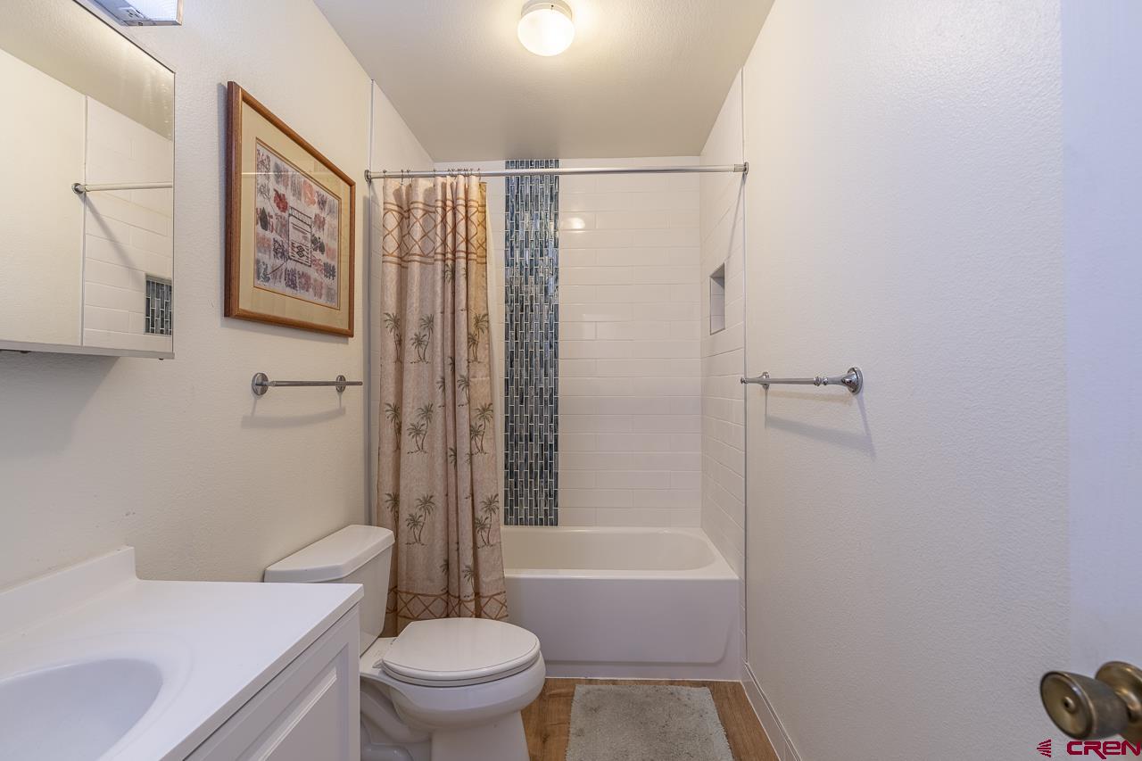 1900 Florida Road, Unit A6 Durango, CO 81301 - Photo 20 of 25 a white toilet sitting next to a bath tub