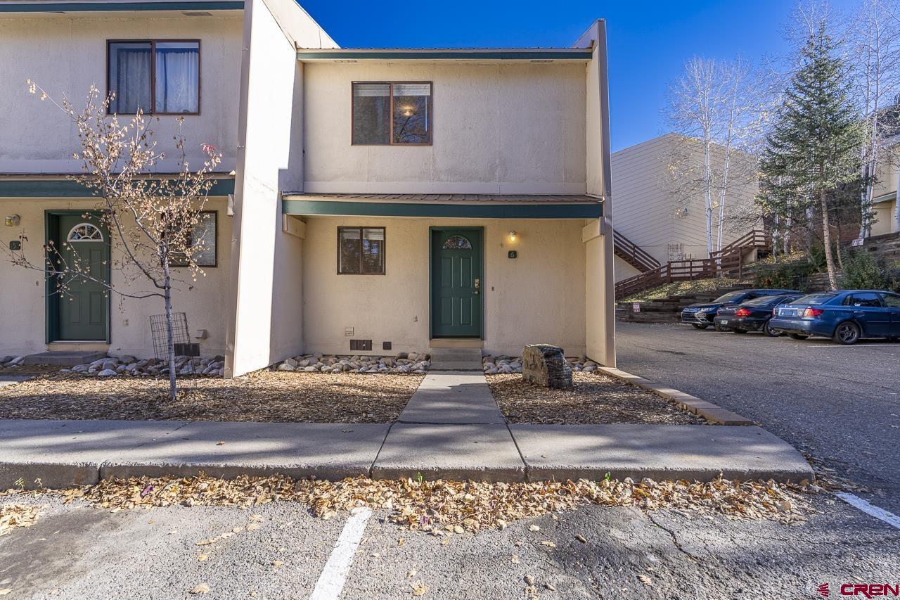 1900 Florida Road, Unit A6 Durango, CO 81301 - Photo 24 of 25 a front view of a house with a yard