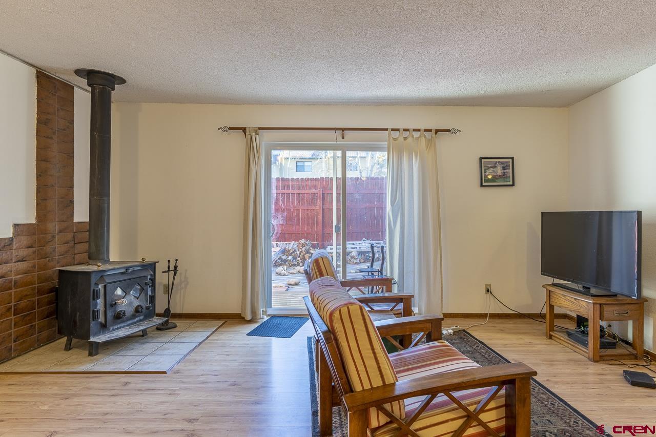 1900 Florida Road, Unit A6 Durango, CO 81301 - Photo 5 of 25 a living room with furniture and a flat screen tv