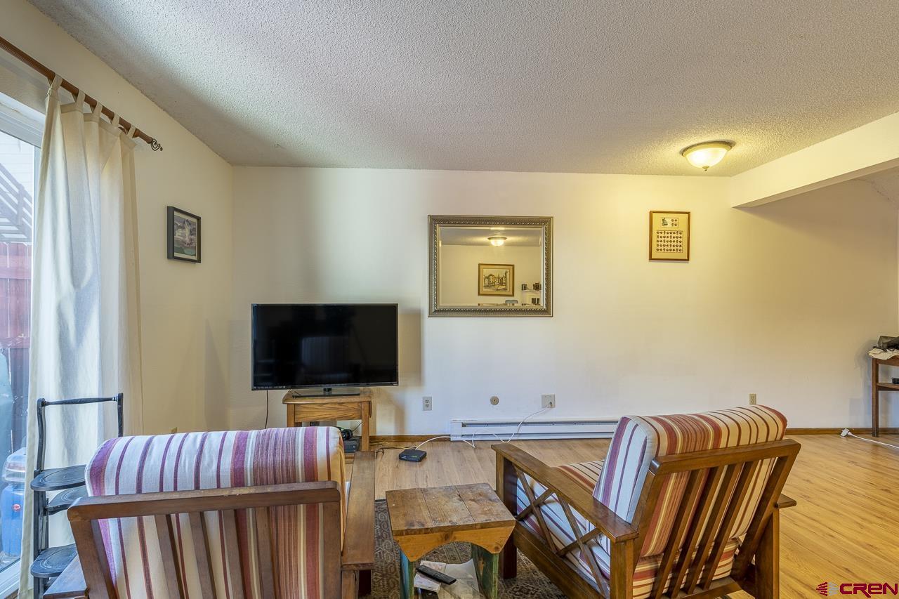 1900 Florida Road, Unit A6 Durango, CO 81301 - Photo 6 of 25 a living room with furniture and a flat screen tv