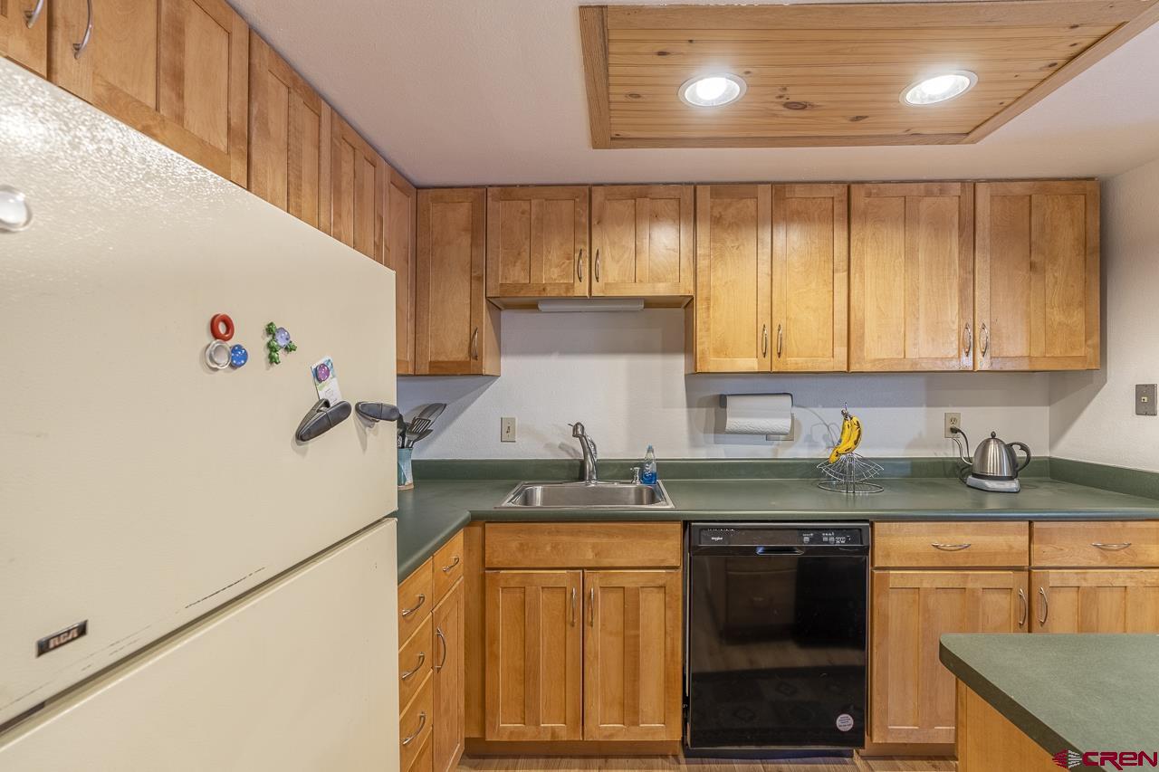 1900 Florida Road, Unit A6 Durango, CO 81301 - Photo 8 of 25 a kitchen with granite countertop cabinets stainless steel appliances and a counter space