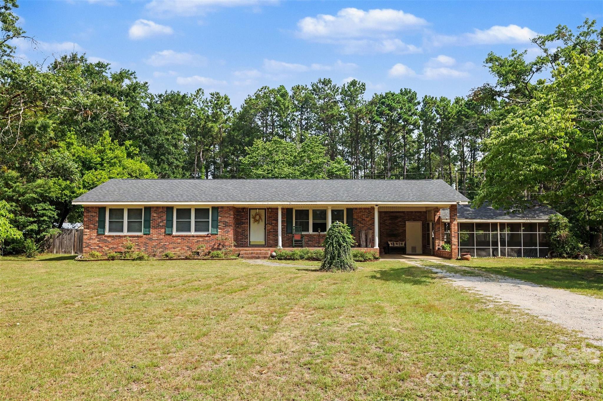 6774 Woodhaven Road Kershaw, SC 29067 - Photo 1 of 30 a front view of a house with garden