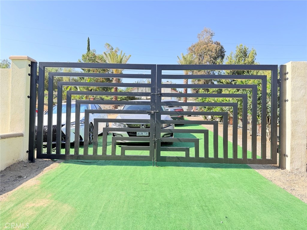 18437 Newman Avenue Riverside, CA 92508 - Photo 36 of 51 Double gate entrance from side yard to front yard. Fully paved and suitable to store RV or other long, large vehicles