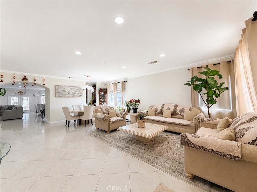 18437 Newman Avenue Riverside, CA 92508 - Photo 4 of 51 Entry with view of elegant living/dining room and arched doorway to the open plan family room / kitchen / eating nook.