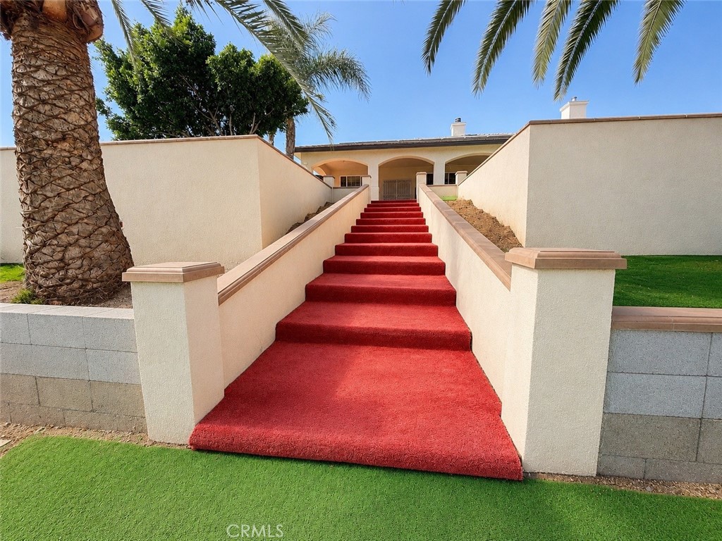 18437 Newman Avenue Riverside, CA 92508 - Photo 42 of 51 Stairs from top level of terrace (back of home) to lower level of backyard