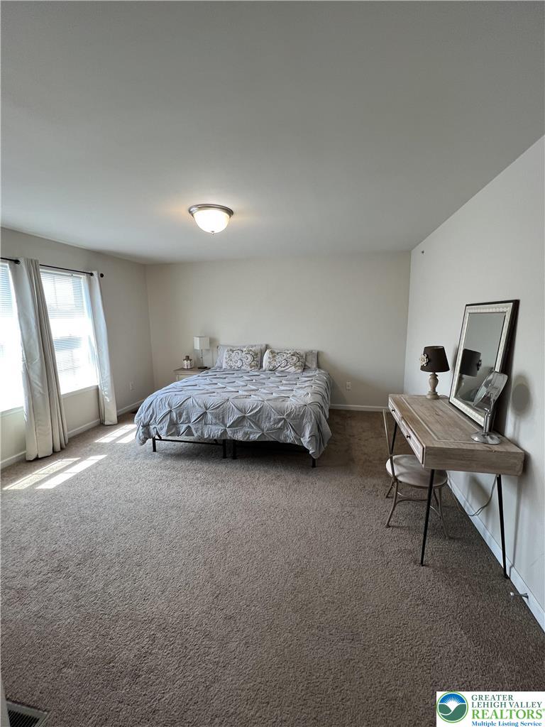 5380 Jutland Road Allentown, PA 18104 - Photo 17 of 27 A spacious bedroom offers plush carpeting and natural light from the large window.