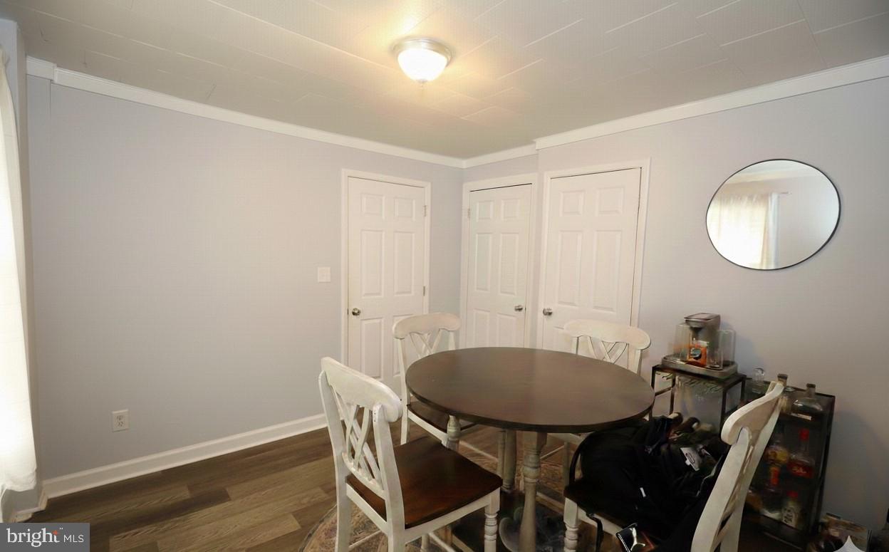 116 Ellis Street Glassboro, NJ 08028 - Photo 7 of 10 a view of a dining room with furniture and wooden floor