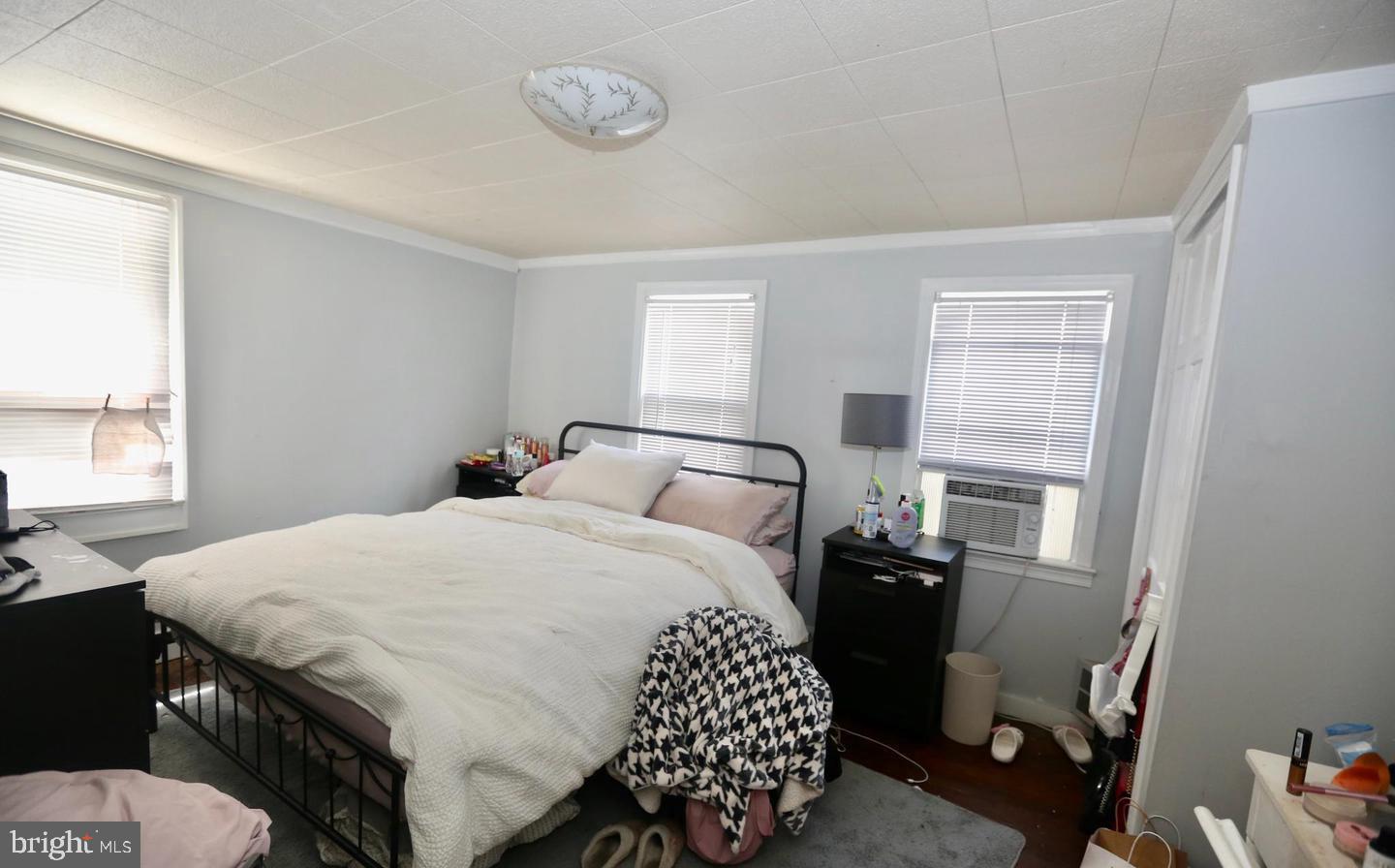 116 Ellis Street Glassboro, NJ 08028 - Photo 9 of 10 a bedroom with a bed and wooden floor