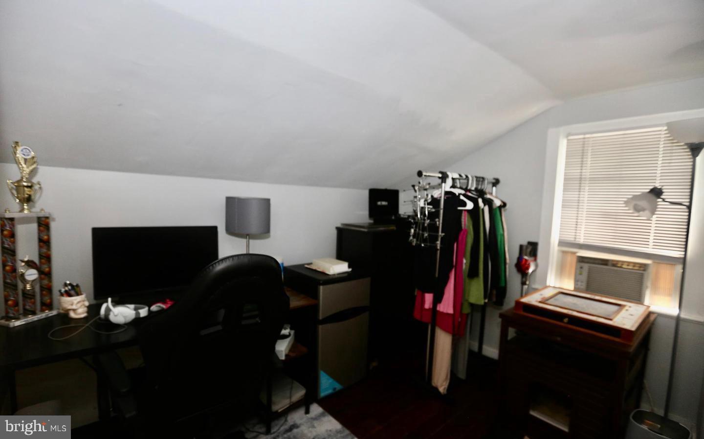 116 Ellis Street Glassboro, NJ 08028 - Photo 10 of 10 a living room with furniture a flat screen tv and a fireplace
